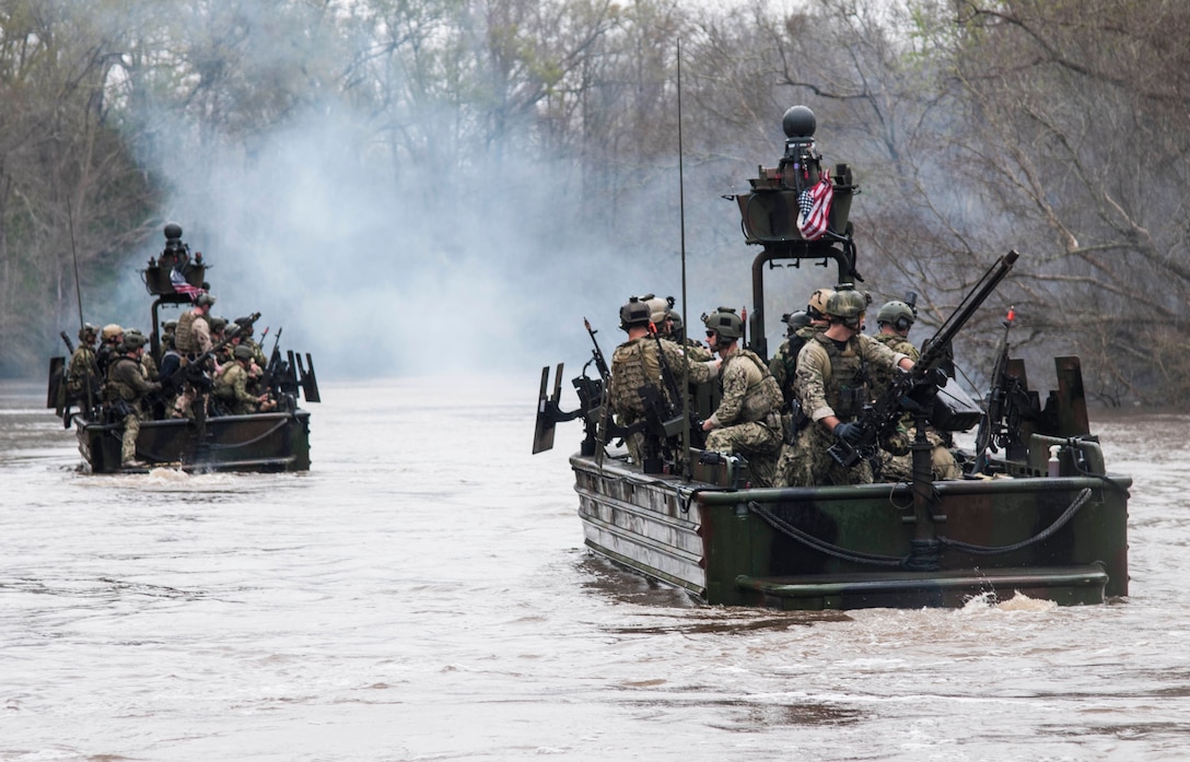 Army Lt. Gen. Raymond A. Thomas III, commander of, Joint Special Operations Command, participates in a riverine demonstration with members of Special Boat Team 22 at the Naval Small Craft Instruction and Technical Training School in Mississippi, March 12, 2015. Thomas now commands U.S. Special Operations Command. Navy photo by Seaman Richard Miller