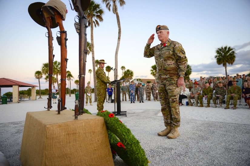 Army Gen. Raymond A. Thomas III, commander of U.S. Special Operations Command, salutes after placing a wreath on a memorial in remembrance of Australian and New Zealand Army Corps Day, April 25, 2017, at MacDill Air Force Base, Fla. Anzac Day i marks the anniversary of the first major military action fought by Australian and New Zealand forces during WWI. Air Force photo by Tech. Sgt. Angelita Lawrence