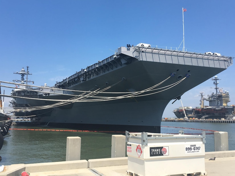 The aircraft carrier Gerald R. Ford is docked at Pier 11,Naval Station Norfolk, Va., June 30, 2017. The ship was undergoing preparations for its commissioning ceremony. The aircraft carrier USS George Washington is at background right. DoD photo by Thomas M. Ruyle
