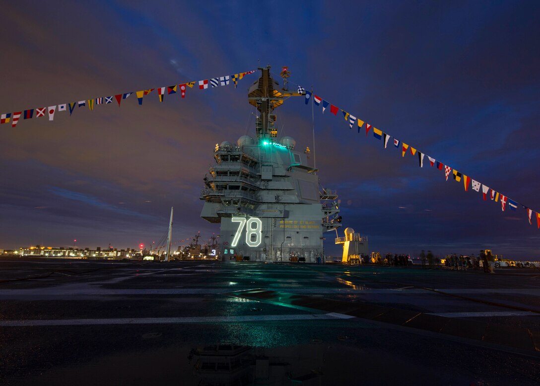 The aircraft carrier Gerald R. Ford displays "up and over" flags in observance of Independence Day while docked in Newport News, Va., July 4, 2017. The Ford was making preparations for its commissioning ceremony. Navy photo by Petty Officer 2nd Class Ryan Litzenberger