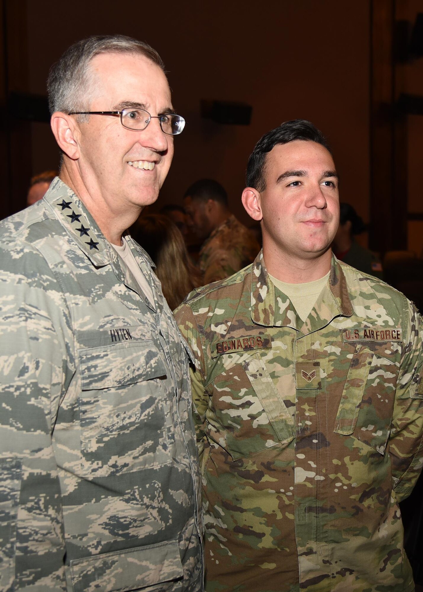General John Hyten, commander of U.S. Strategic Command, poses for a photo with Senior Airman Ethan Edwards, member of the 90th Security Forces group, after an all-call at the F. E. Warren Air Force Base, Wyo., theater July 21, 2017. The Omaha Trophy is awarded to the best missile wing in USSTRATCOM. (U.S. Air Force photo by Glenn S. Robertson)