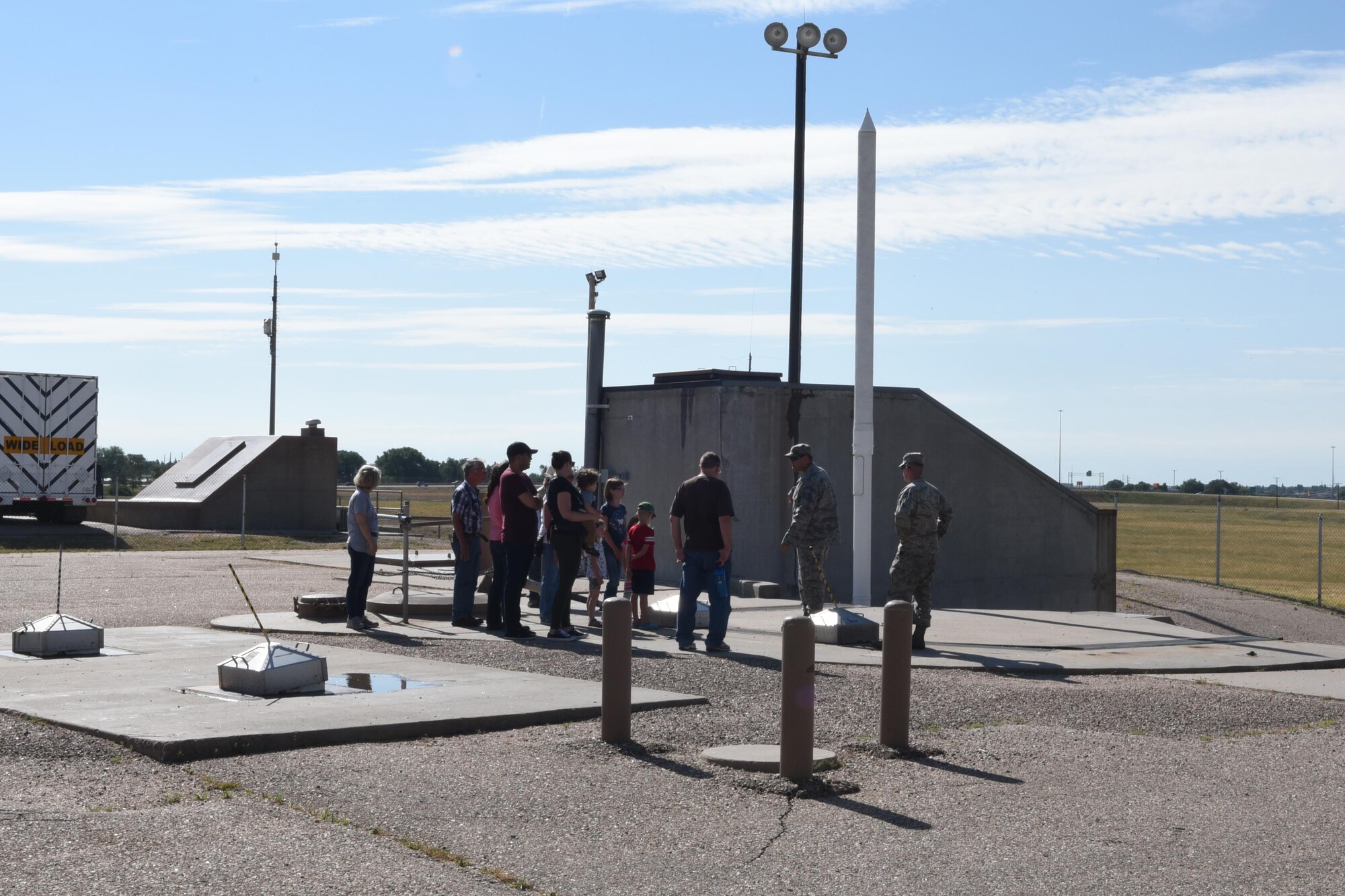 Tech. Sgt. Ruben Guerra, 790 MXS, section chief, talks to members of a tour of Uniform-01, a Minuteman III ICBM launch facility trainer during Fort D.A. Russell Days, at F.E. Warren Air Force Base, Wyo., July 22, 2017.  These types of tours allow the public to see what launch facilities look like throughout Nebraska, Wyoming and Colorado. (U.S. Air Force photo by Terry Higgins)