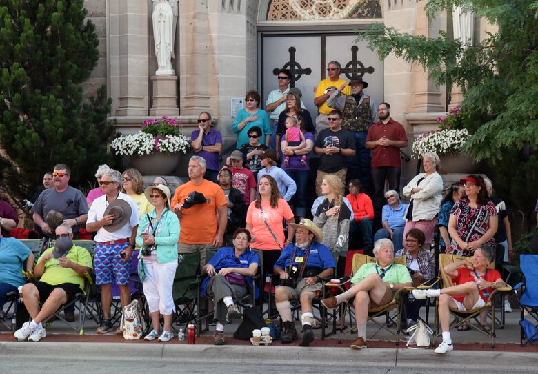Spectators watch Airmen from the 90th Missile Wing march during the 121st Cheyenne Frontier Days opening grand parade in Cheyenne, Wyo., July 22, 2017. CFD is Cheyenne’s biggest annual event with hundreds of visitors taking part. This year marks the 150th anniversary of F.E. Warren Air Force Base and the city of Cheyenne. The two communities came together to celebrate during the 121st CFD rodeo and festival. (U.S. Air Force photo by Airman 1st Class Breanna Carter)