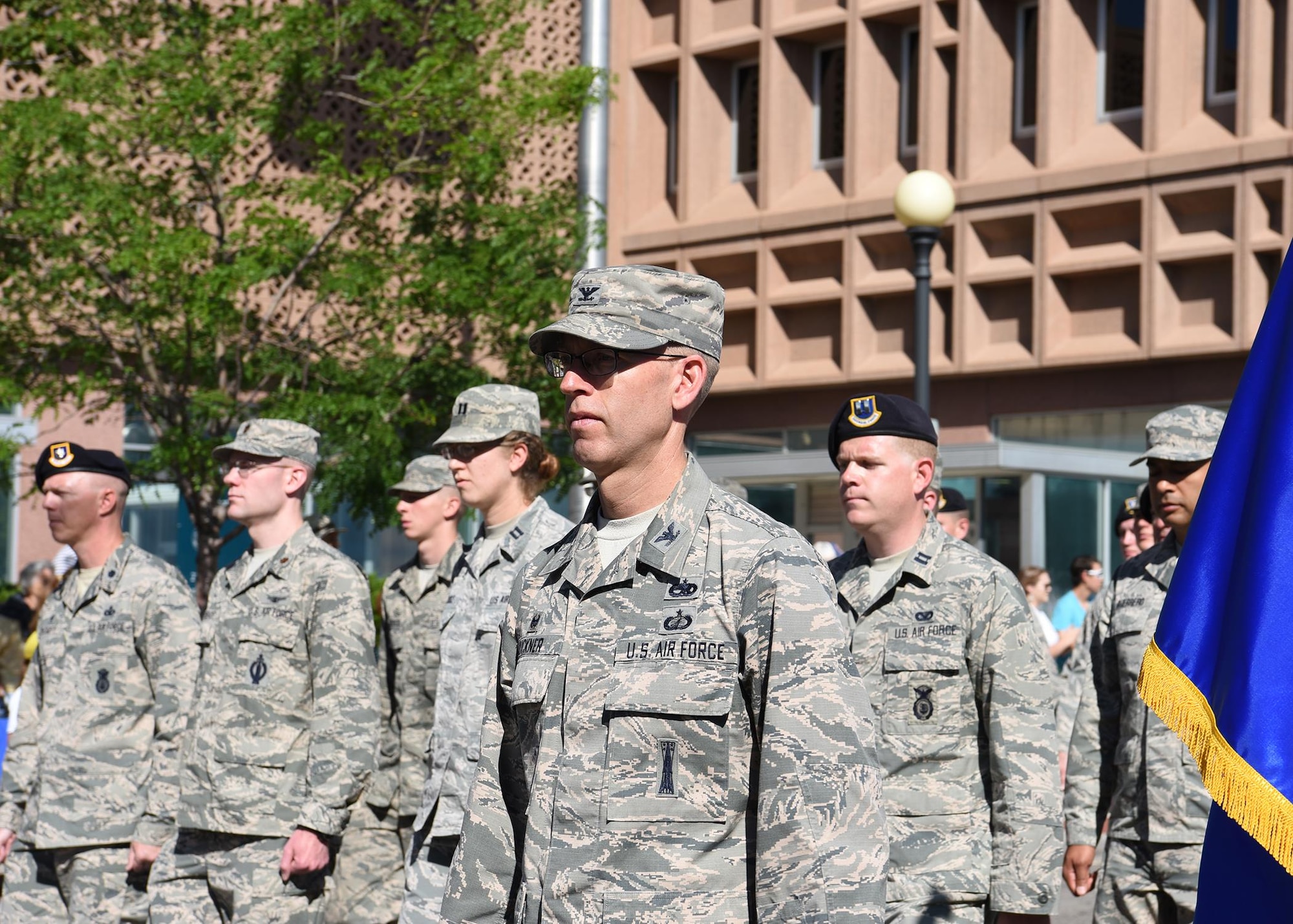 Col. Greg Buckner, 90th Maintenance Group commander, leads a formation of Airmen from the 90th Missile Wing during the 121st Cheyenne Frontier Days grand opening parade in Cheyenne, Wyo. July 22, 2017. Buckner has been in the Air Force since 1994 and arrived at F.E. Warren Air Force Base in 2016. This year marks the 150th anniversary of F.E. Warren Air Force Base and the city of Cheyenne. The two communities came together to celebrate during the 121st CFD rodeo and festival. (U.S. Air Force photo by Airman 1st Class Braydon Williams)