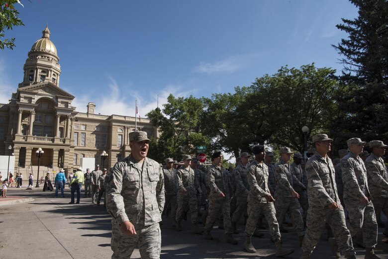 Master Sgt. Royal Maxey, 90th Missile Security Forces Squadron member, calls cadence for the flight of Airmen from the 90th Missile Wing during the 121st Cheyenne Frontier Days grand opening parade in Cheyenne, Wyo. July 22, 2017.  Every year, Airmen participate in CFD and contribute to the success of the city’s largest annual event. This year marks the 150th anniversary of F.E. Warren Air Force Base and the city of Cheyenne. The two communities came together to celebrate during the 121st CFD rodeo and festival. (U.S. Air Force photo by Staff Sgt. Christopher Ruano)