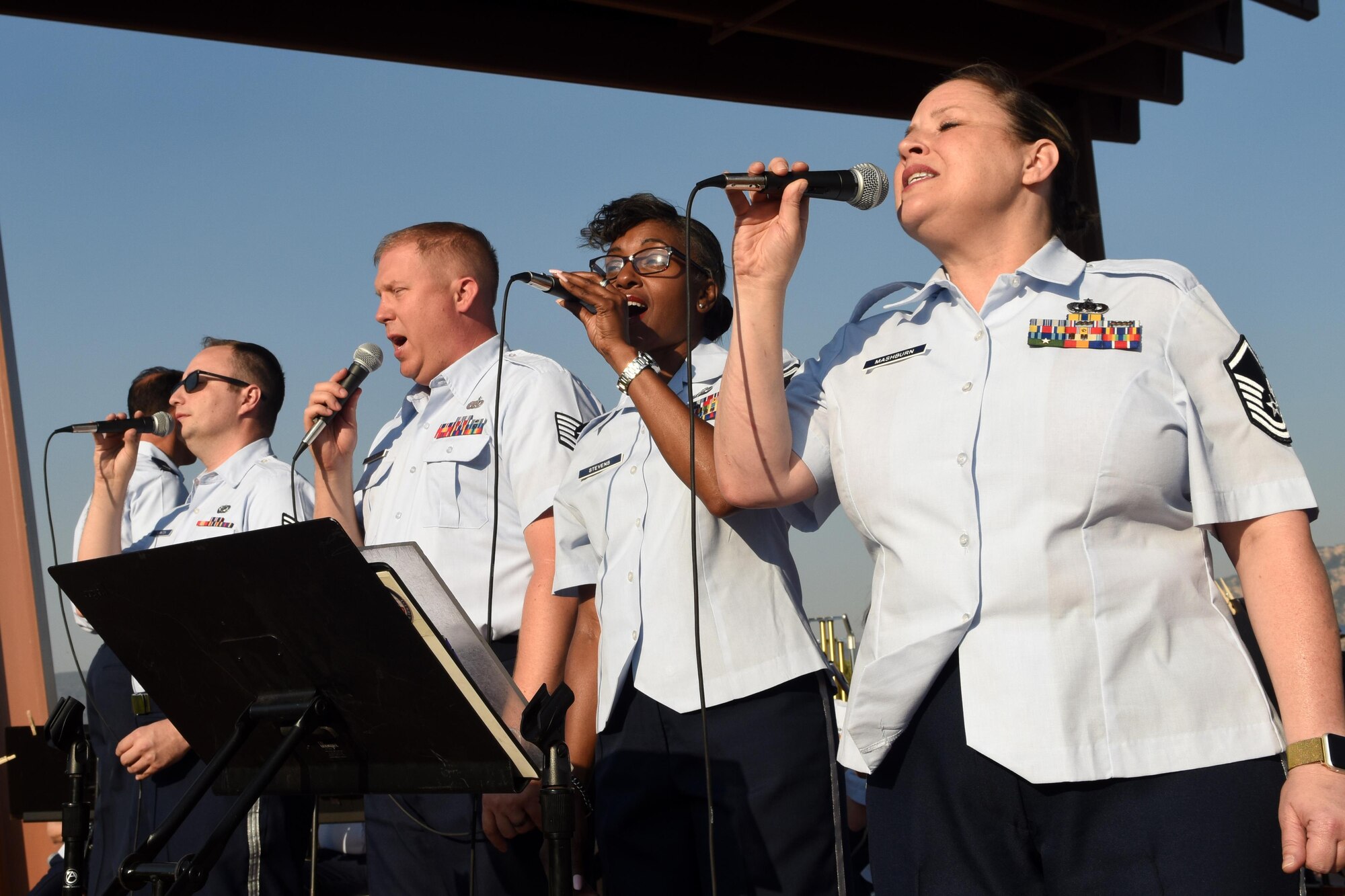 Senior Airman Will Thorton, Tech Sgt. Josh Keen, and Master Sgt.’s Erika Stevens and Shonda Mashburn, Band of the Southwest vocalists, perform a medley of songs by famous composer William Grant Still during a show June 29 in Sedona, NM. The performance featured music from other American composers, Hollywood legends, and well-known blockbusters. (Texas Air National Guard photo by Staff Sgt. Kristina Overton)