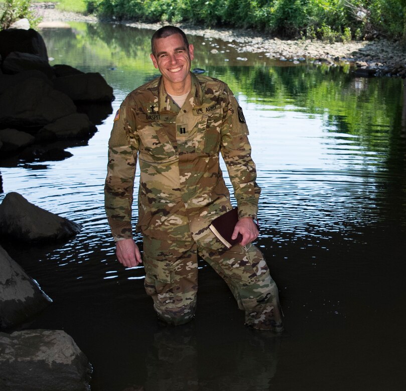 Capt. Doug Daspit, U.S. Army Reserve chaplain for the 321st Sustainment Brigade located in Baton Rouge, Louisiana, poses for a portrait in knee-deep water after receiving the Chaplain of the Year award during the Reserve Officers Association National Convention in Crystal City, Virginia, July 22. Daspit was nominated for his response to recent Baton Rouge floods, providing one-on-one pastoral counseling to 38 Soldiers and their affected families. (U.S. Army Reserve photo by Sgt. Audrey Hayes)