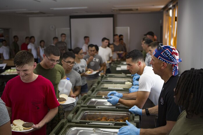 U.S. Marines with Marine Aviation Logistics Squadron (MALS) 12 attend a cookout sponsored by the USO on Marine Corps Air Station Iwakuni, Japan, July 21, 2017. The USO hosted a field meet and cookout for MALS-12, which included several competitions such as grappling, pull-ups and a Humvee pull. (U.S. Marine Corps photo by Lance Cpl. Jacob A. Farbo)