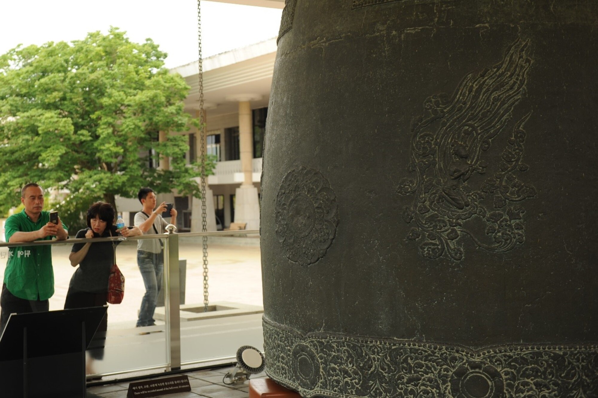 Visitors of the Gyeongju National Museum read about the Divine Bell of King Seongdeok in Gyeongju, Republic of Korea, July 18, 2017.  The bell was completed in 771 and is still operational, ringing out the hour every day. Nearly 100 United States Forces Korea members were invited by the Ministry of Patriots and Veterans Affairs to tour this location and other historic sites across the ROK as part of an initiative to give U.S. personnel a better understanding of Korean culture and patriotism. (U.S. Air Force photo by 1st Lt. Lauren Linscott/Released)