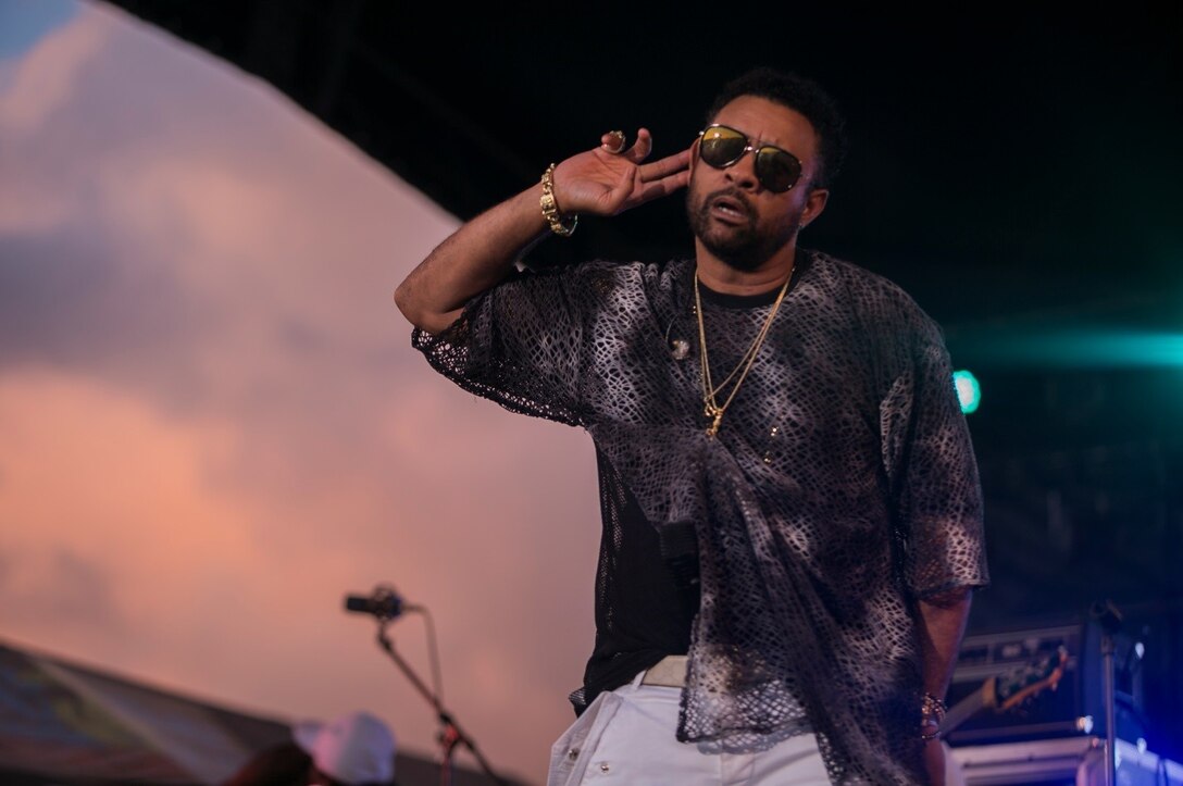 CAMP HANSEN, OKINAWA, Japan – Shaggy listens to the crowd cheer during a concert July 22 aboard Camp Hansen, Okinawa, Japan. Shaggy, a former field artillery cannon crewmember for the Marine Corps, is now a Jamaican-American reggae fusion singer and DJ. The free concert was open to the military and local community. (U.S Marine photo by Lance Corporal Tayler P. Schwamb)