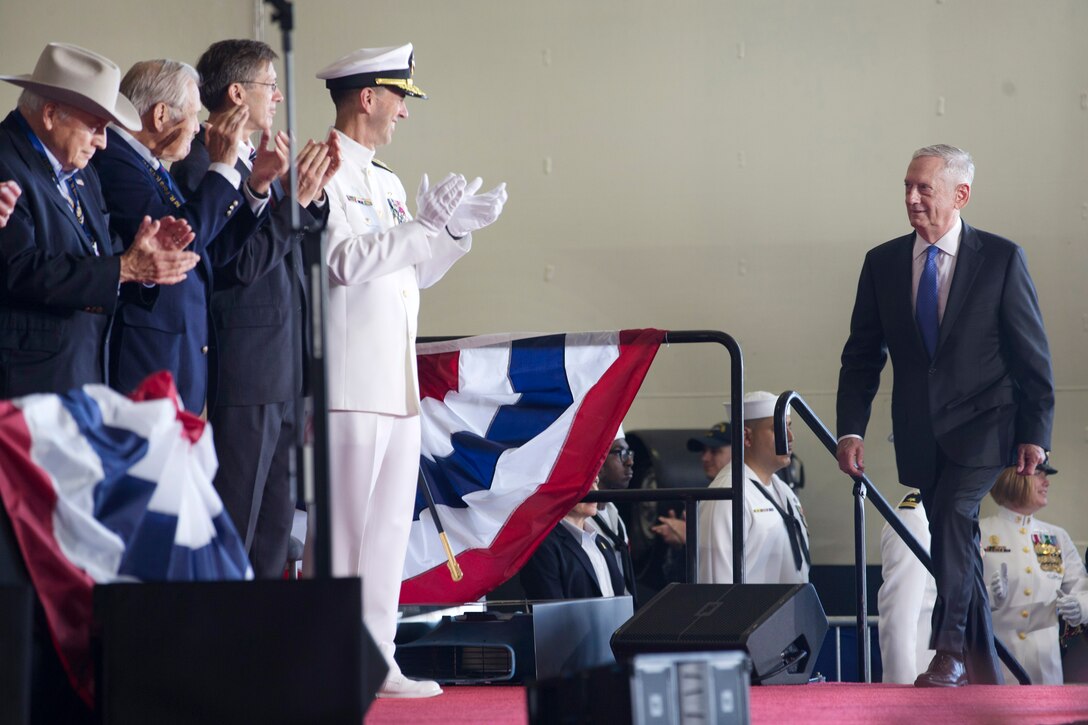 Defense Secretary Jim Mattis enters the hangar bay of the aircraft carrier USS Gerald R. Ford during the ship's commissioning ceremony at Naval Station Norfolk, Va., July 22, 2017. Ford is the lead ship of the Ford-class aircraft carriers, and the first new U.S. aircraft carrier design in 40 years. Navy photo by Petty Officer 3rd Class Gitte Schirrmacher