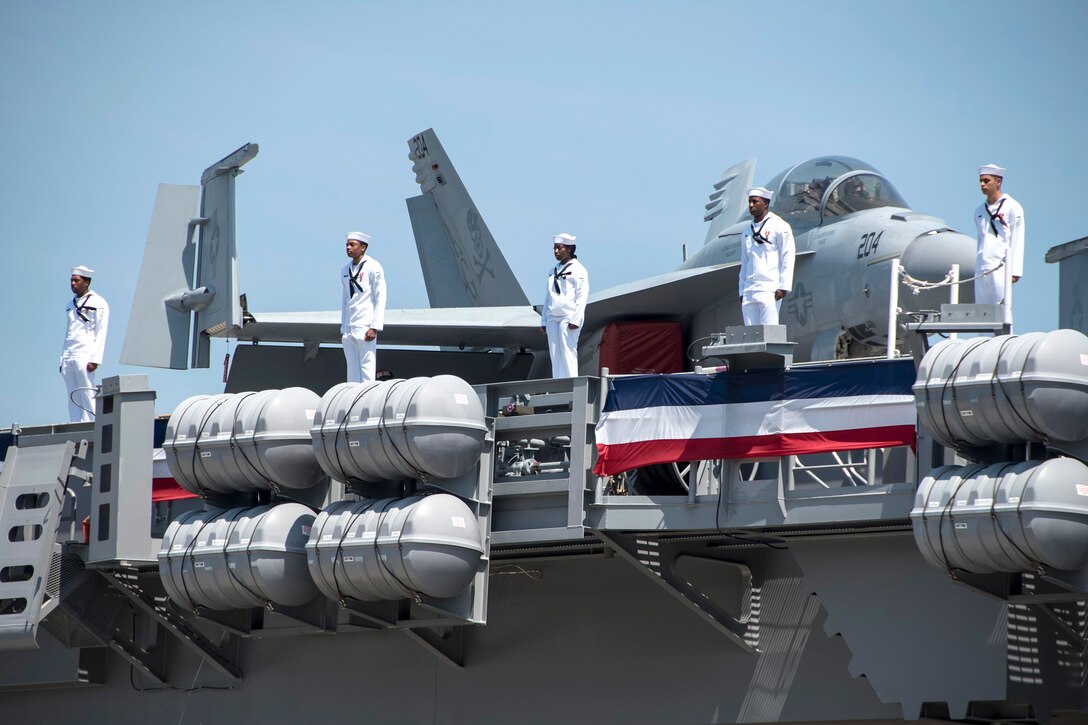 Sailors man the rails of the aircraft carrier USS Gerald R. Ford during the ship's commissioning ceremony at Naval Station Norfolk, Va., July 22, 2017. Navy photo by Petty Officer 3rd Class Julio Martinez Martinez