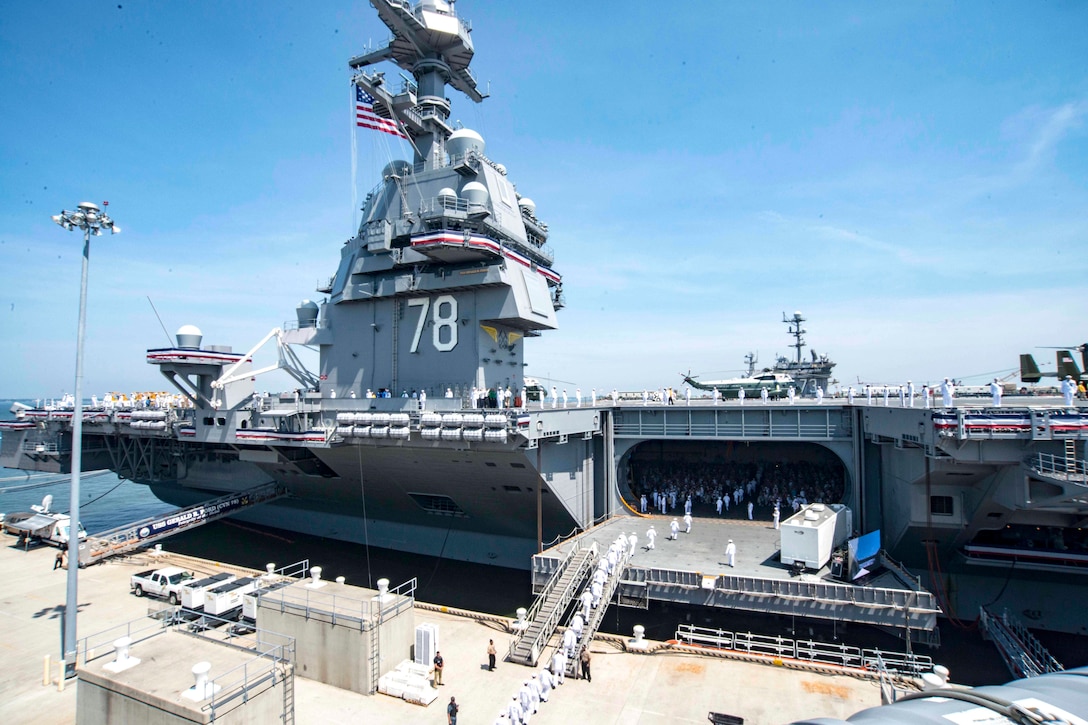 Sailors man the rails of the aircraft carrier USS Gerald R. Ford during the ship's commissioning ceremony at Naval Station Norfolk, Va., July 22, 2017. Navy photo by Petty Officer 2nd Class Andrew J. Sneeringer