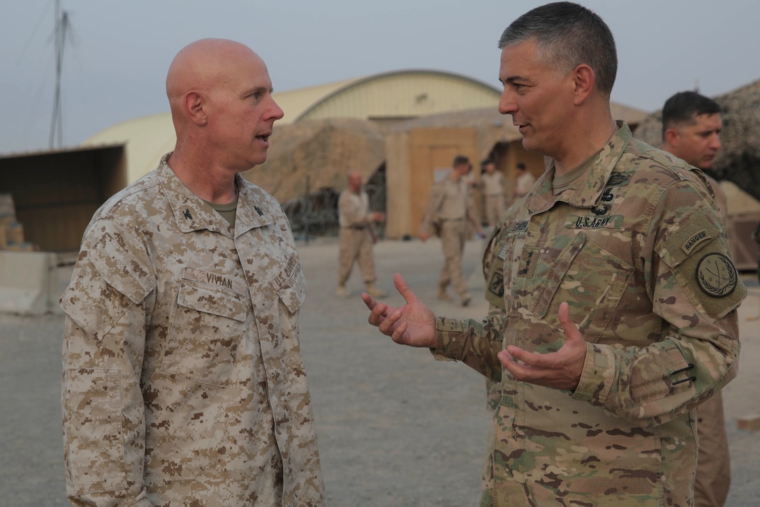 U.S. Army Lt. Gen. Stephen Townsend, the commanding general of Combined Joint Task Force-Operation Inherent Resolve, speaks with U.S. Marine Corps Col. Bill Vivian, the commanding officer of Special Purpose Marine Air-Ground Task Force-Crisis Response-Central Command in the Middle East, July 6, 2017. During his visit, Townsend spoke with SPMAGTF-CR-CC Marines about the importance of tactical recovery of aircraft and personnel missions and recognized Marines for excellence. SPMAGTF-CR-CC continues its commitment to support Operation Inherent Resolve and USCENTCOM by providing a range of crisis response capabilities. CJTF-OIR is the global Coalition to defeat ISIS in Iraq and Syria. (U.S. Marine Corps photo by Cpl. Shellie Hall)