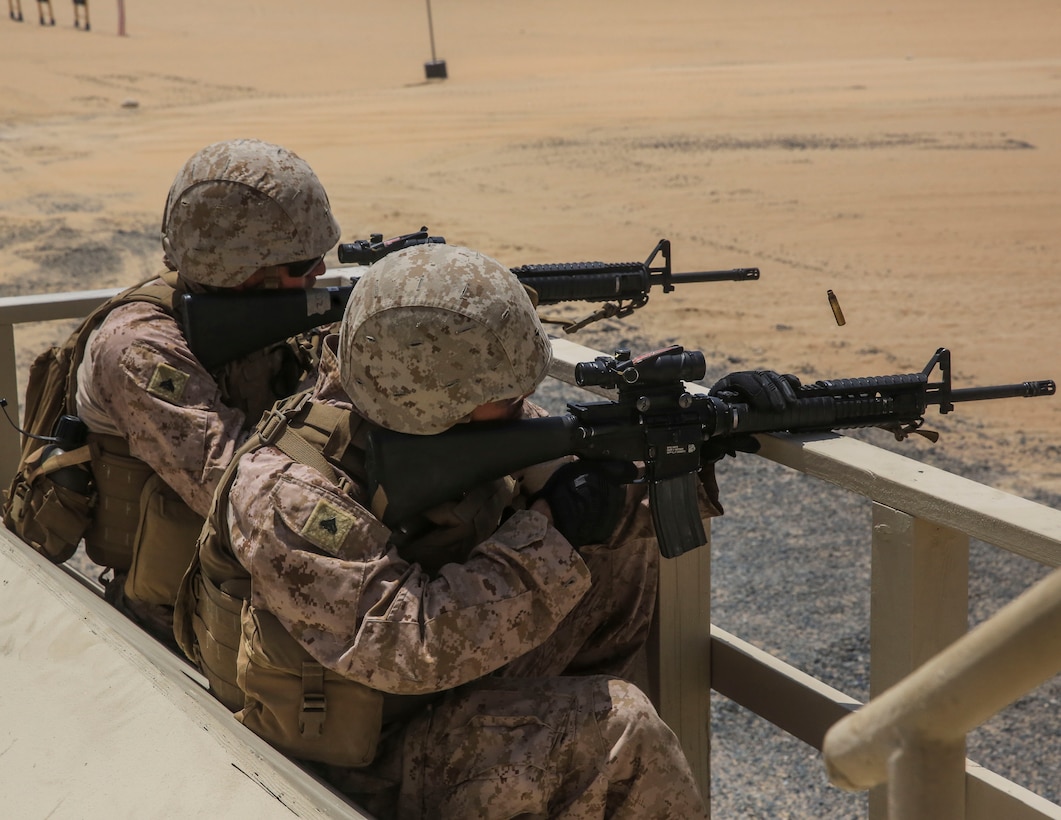 U.S. Marines Cpl. Jeremy Roistorres and Cpl. Zach Perigo, technical controllers assigned with Marine Support Squadron (MWSS) 372, Special Purpose Marine Air-Ground Task Force-Crisis Response-Central Command (SPMAGTF-CR-CC) participate in combat marksmanship training while forward deployed in the Middle East, July 4, 2017. SPMAGTF-CR-CC Marines are prepared to react and respond to a variety of scenarios that may occur across the U.S. Central Command area of operations. (U.S. Marine Corps photo by Cpl. Kyle McNan)