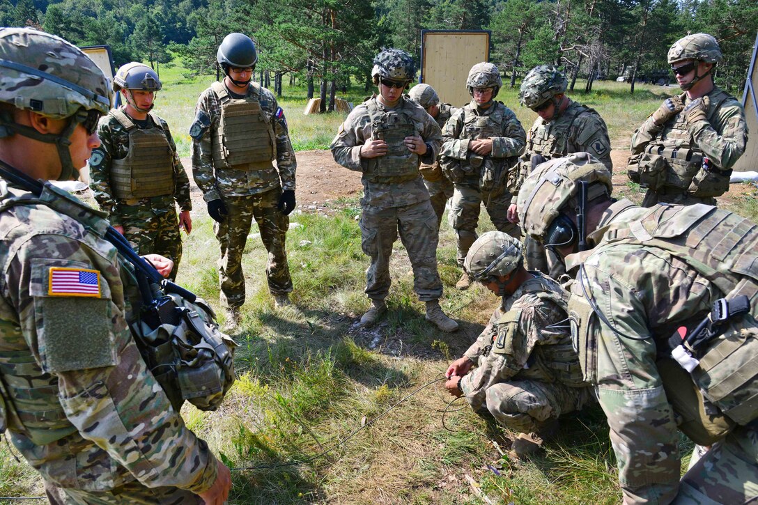 U.S. paratroopers and Slovenian soldiers prepare a C4 explosive charge during a live-fire demolition as part of Exercise Rock Knight at Pocek Range in Postonja, Slovenia, July 20, 2017. The paratroopers are assigned to the 54th Brigade Engineer Battalion, 173rd Airborne Brigade. The exercise is a bilateral training exercise between U.S. and Slovenian armed forces, focused on small-unit tactics and building on previous lessons learned, forging the bonds and enhancing readiness between allied forces. Army photo by Paolo Bovo