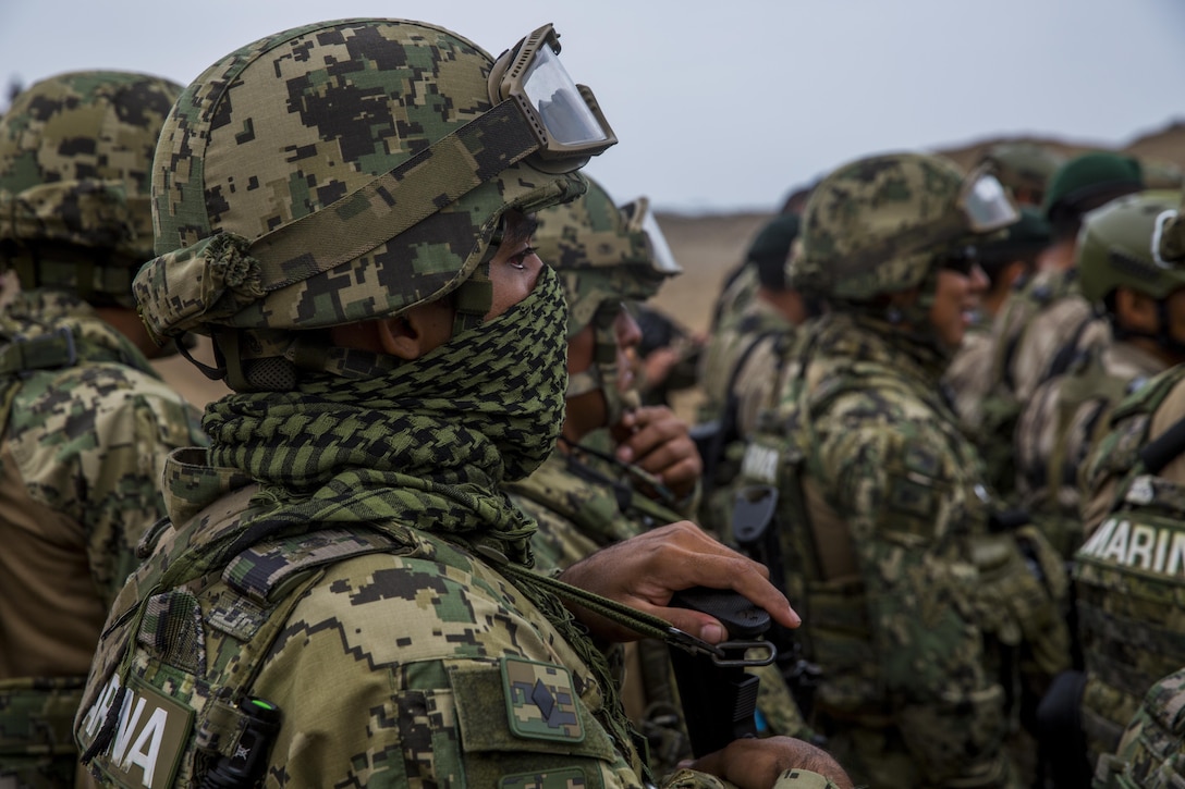 A Peruvian marine engages targets while conducting sniper rifle drills during UNITAS 2017 at Ancon, Peru, July 20, 2017. UNITAS is an annual, multinational exercise that focuses on strengthening existing regional partnerships and encourages establishing new relationships through the exchange of maritime mission-focused knowledge and expertise during multinational training operations. (U.S. Marine Corps photo by Lance Cpl. Taylor W. Cooper)