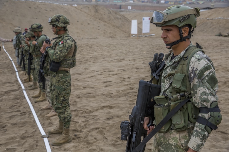 A Peruvian marine engages targets while conducting sniper rifle drills during UNITAS 2017 at Ancon, Peru, July 20, 2017. UNITAS is an annual, multinational exercise that focuses on strengthening existing regional partnerships and encourages establishing new relationships through the exchange of maritime mission-focused knowledge and expertise during multinational training operations. (U.S. Marine Corps photo by Lance Cpl. Taylor W. Cooper)