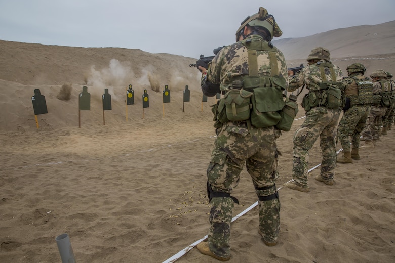 A Peruvian marine engages targets while conducting sniper rifle drills during UNITAS 2017 at Ancon, Peru, July 20, 2017. UNITAS is an annual, multinational exercise that focuses on strengthening existing regional partnerships and encourages establishing new relationships through the exchange of maritime mission-focused knowledge and expertise during multinational training operations. (U.S. Marine Corps photo by Lance Cpl. Taylor W. Cooper)