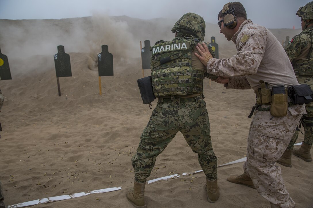 A Peruvian marine engages targets while conducting sniper rifle drills during UNITAS 2017 at Ancon, Peru, July 20, 2017. UNITAS is an annual, multinational exercise that focuses on strengthening existing regional partnerships and encourages establishing new relationships through the exchange of maritime mission-focused knowledge and expertise during multinational training operations. (U.S. Marine Corps photo by Lance Cpl. Taylor W. Cooper)