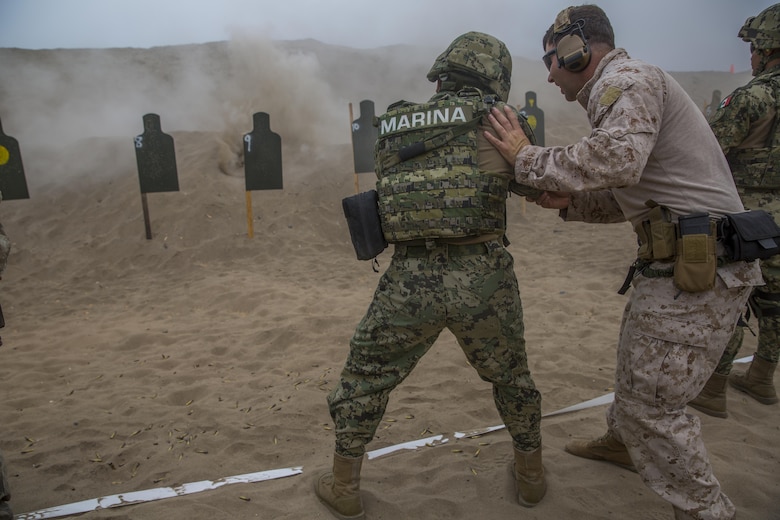 A Peruvian marine engages targets while conducting sniper rifle drills during UNITAS 2017 at Ancon, Peru, July 20, 2017. UNITAS is an annual, multinational exercise that focuses on strengthening existing regional partnerships and encourages establishing new relationships through the exchange of maritime mission-focused knowledge and expertise during multinational training operations. (U.S. Marine Corps photo by Lance Cpl. Taylor W. Cooper)