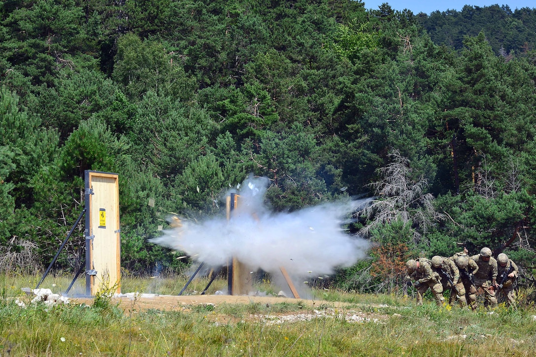 U.S. paratroopers stand fast after detonating a C4 charge on a door as part of urban breach training during Exercise Rock Knight at Pocek Range in Postonja, Slovenia, July 20, 2017. Army photo by Paolo Bovo