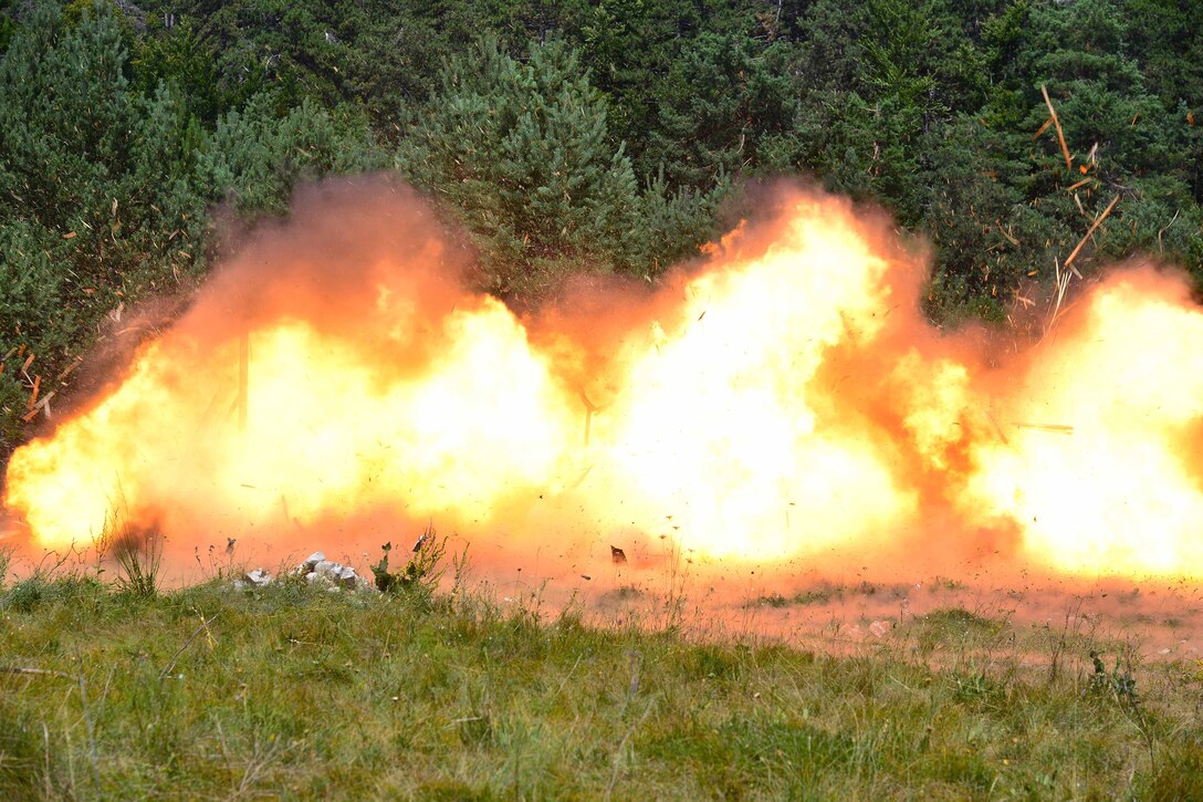 U.S. paratroopers detonate multiple C4 explosive charges on doors while conducting urban breach training as part of Exercise Rock Knight at Pocek Range in Postonja, Slovenia, July 20, 2017. Army photo by Paolo Bovo