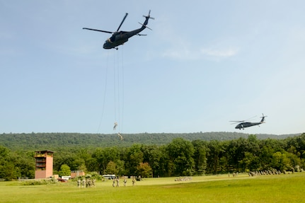 Soldiers with Fort Indiantown Gap’s inaugural Air Assault course rappel from a UH-60 Black Hawk helicopter operated by pilots from the Eastern Army National Guard Aviation Training Site July 20, 2017. T