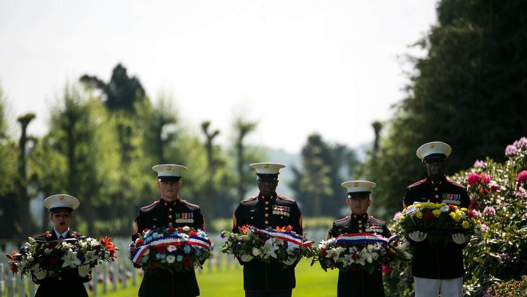 Marines with U.S. Marine Corps Forces Europe and Africa prepare to deliver a wreath to distinguished guests at the Aisne-Marne American Cemetery commemoration of the fallen heroes in Belleau, France on May 28, 2017. This Memorial Day ceremony was held in honor of the 99th anniversary of the battle of Belleau Wood. (U.S. Marine Corps photo by SSgt. Marcin Platek)