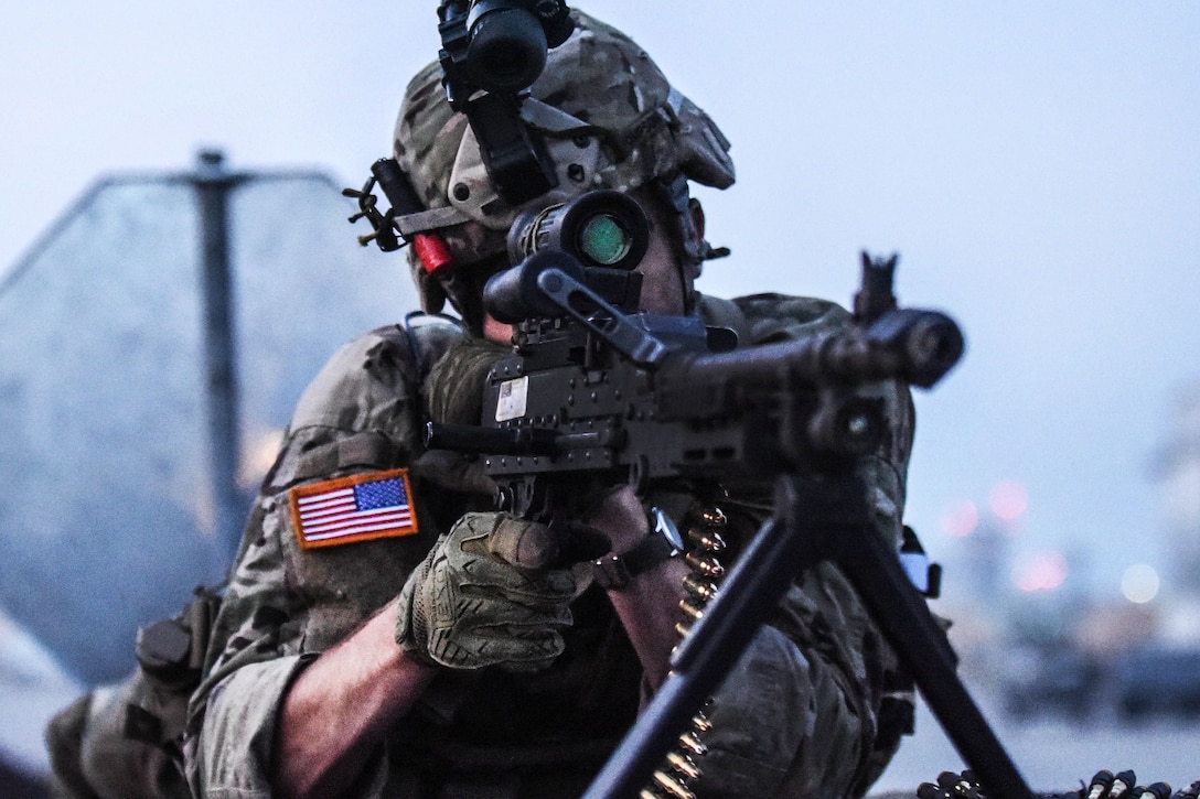 A soldier aims his machine gun during Exercise Saber Guardian 17 in Turzii, Romania, July 22, 2017. Army photo by Sgt. David Vermilyea