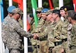 Maj. Gen. Murat Bektanov, Kazakhstan Land Forces commander, greets representatives from each nation participating in Exercise Steppe Eagle 17 during the opening ceremony July 22, 2017, at Illisky Training Center, Kazakhstan. (U.S. Army photo by Capt. Desiree Dillehay, 149th Military Engagement Team)