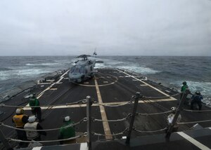 PACIFIC OCEAN (July 18, 2017) - Sailors assigned to Helicopter Submarine Maritime (HSM) 47 Detachment 4 "Players" stand by on the flight deck of USS Chaffee (DDG 90) for the start of the cross deck exercise between ships participating in UNITAS 2017. UNITAS is an annual exercise that focuses on strengthening our existing regional partnerships and encourages establishing new relationships through the exchange of maritime mission-focused knowledge and expertise throughout the exercise. (U.S. Navy photo by Mass Communication Specialist 2nd Class Michael Hendricks/Released)