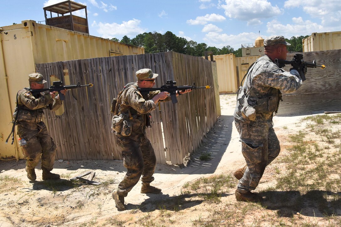 South Carolina Army National Guard members advance toward their follow-on objective while participating in the Spur Ride at McCrady Training Center in Eastover, S.C., July 14, 2017. Army National Guard photo by Spc. Chelsea Baker 
