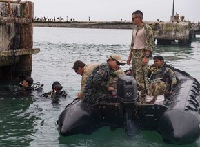 SAN LORENZO ISLAND, Peru (July 20, 2017) Sailors assigned to Explosive Ordnance Disposal Mobile Unit set explosive tools during a shock wave generator training exercise with Peruvian special forces as part of UNITAS 2017. UNITAS is an annual, multi-national exercise that focuses on strengthening our existing regional partnerships and encourages establishing new relationships through the exchange of maritime mission-focused knowledge and expertise during multinational training operations. (U.S. Navy photo by Mass Communication Specialist 2nd Class Bill Dodge/Released)
