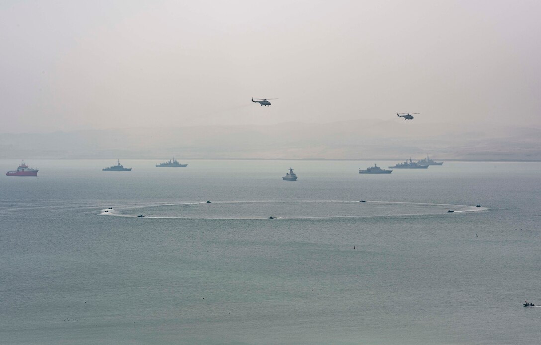 SALINAS, Peru (July 22, 2017) Ships and aircraft representing the 19 nations participating in UNITAS 2017 conduct a joint amphibious landing demonstration. UNITAS is an annual, multi-national exercise that focuses on strengthening our existing regional partnerships and encourages establishing new relationships through the exchange of maritime mission-focused knowledge and expertise during multinational training operations. (U.S. Navy photo by Mass Communication Specialist 2nd Class Bill Dodge/Released)