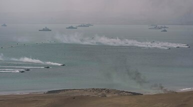 SALINAS, Peru (July 22, 2017) Ships and amphibious craft representing the 19 nations participating in UNITAS 2017 conduct a joint amphibious landing demonstration. UNITAS is an annual, multi-national exercise that focuses on strengthening our existing regional partnerships and encourages establishing new relationships through the exchange of maritime mission-focused knowledge and expertise during multinational training operations. (U.S. Navy photo by Mass Communication Specialist 2nd Class Bill Dodge/Released)