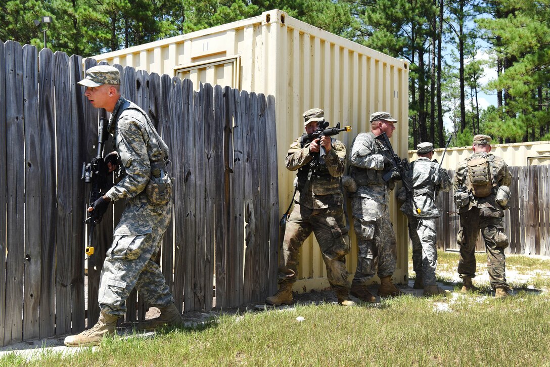 South Carolina Army National Guard members cautiously approach their follow-on objective while participating in the Spur Ride at McCrady Training Center in Eastover, S.C., July 14, 2017. Army National Guard photo by Spc. Chelsea Baker