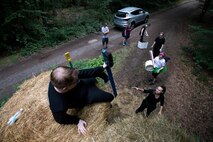 Tooth Slothy, a team of 86th Dental Squadron Airmen, assist each other through an obstacle during the annual resilience day Mudless Mudder on Ramstein Air Base, Germany, July 21, 2017. Each obstacle required the help of teammates to accomplish in an effort to improve cohesion between Airmen. (U.S. Air Force photo by Senior Airman Devin Boyer)