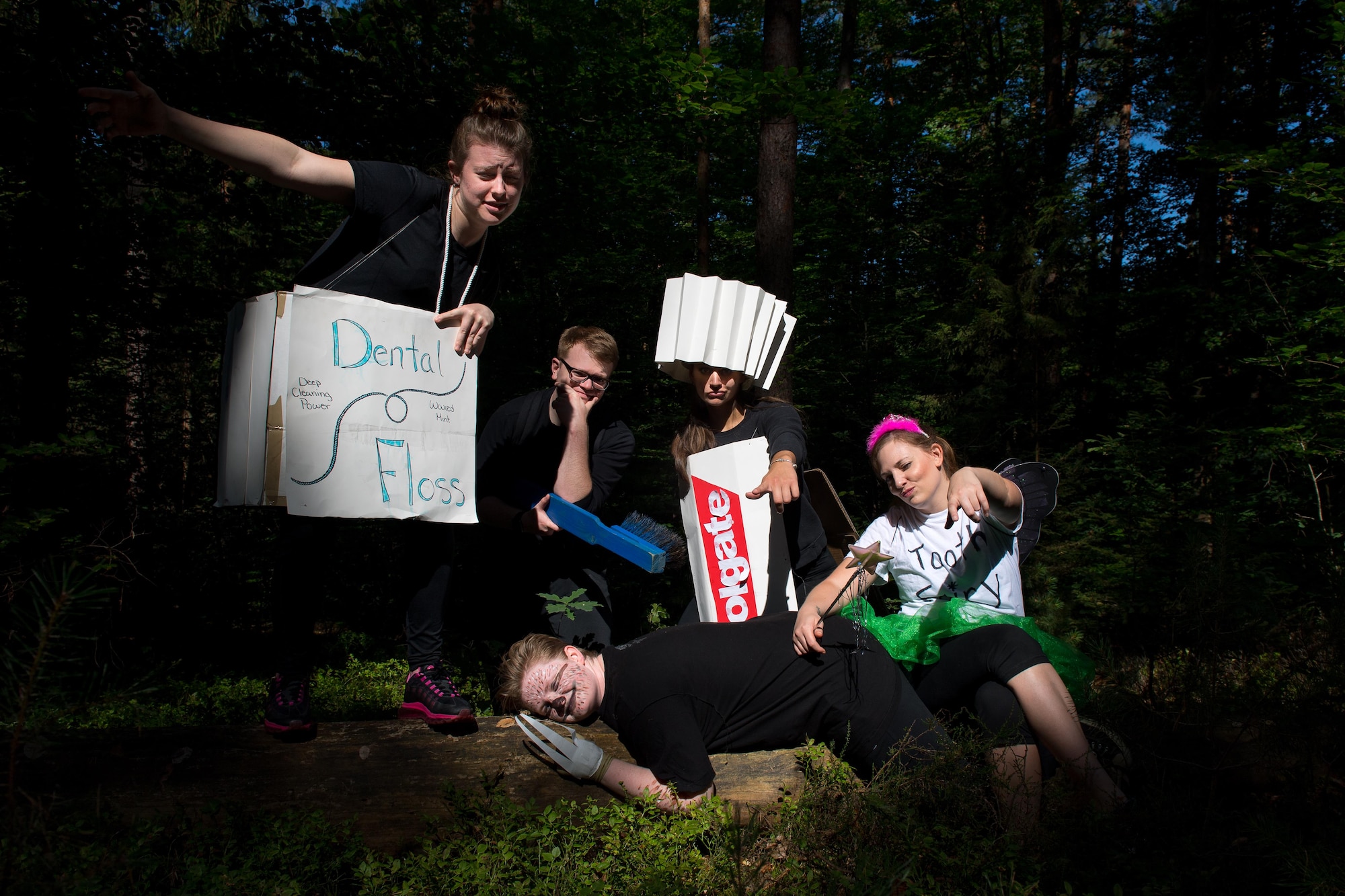 Tooth Slothy, a team of 86th Dental Squadron Airmen, pose for a photo in the woods during the annual Mudless Mudder on Ramstein Air Base, Germany, July 21, 2017. The Mudder hosted more than 80 teams with members dressed up in costumes to show spirit. Tooth Slothy garnered their fourth trophy as the slowest team in the race. (U.S. Air Force photo by Senior Airman Devin Boyer)