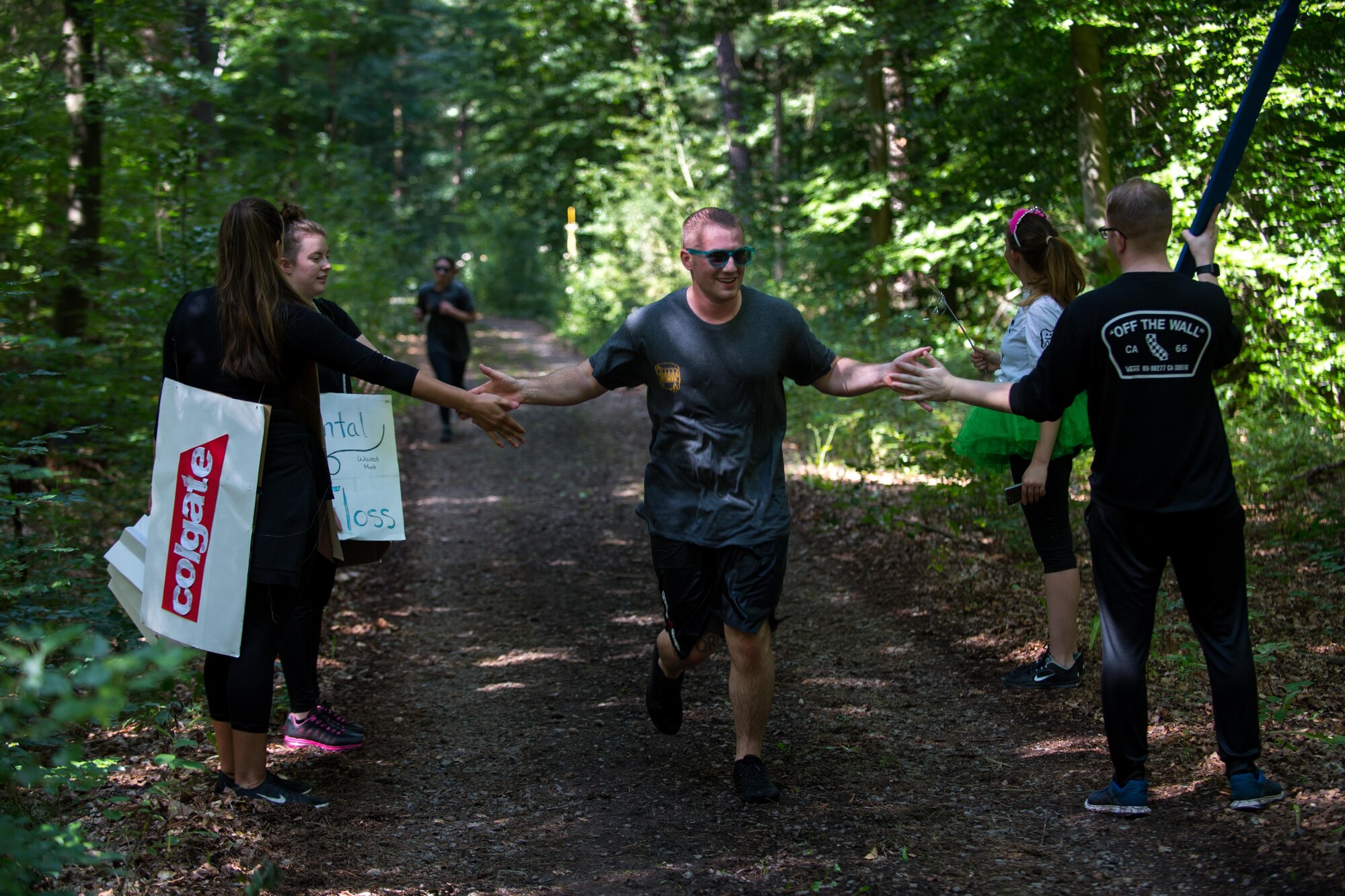 Tooth Slothy, a team of 86th Dental Squadron Airmen, cheer on opposing teams during the annual Mudless Mudder on Ramstein Air Base, Germany, July 21, 2017. The 5 kilometer race brought members from all over the 86th Airlift Wing to promote camaraderie and build resilience. (U.S. Air Force photo by Senior Airman Devin Boyer)