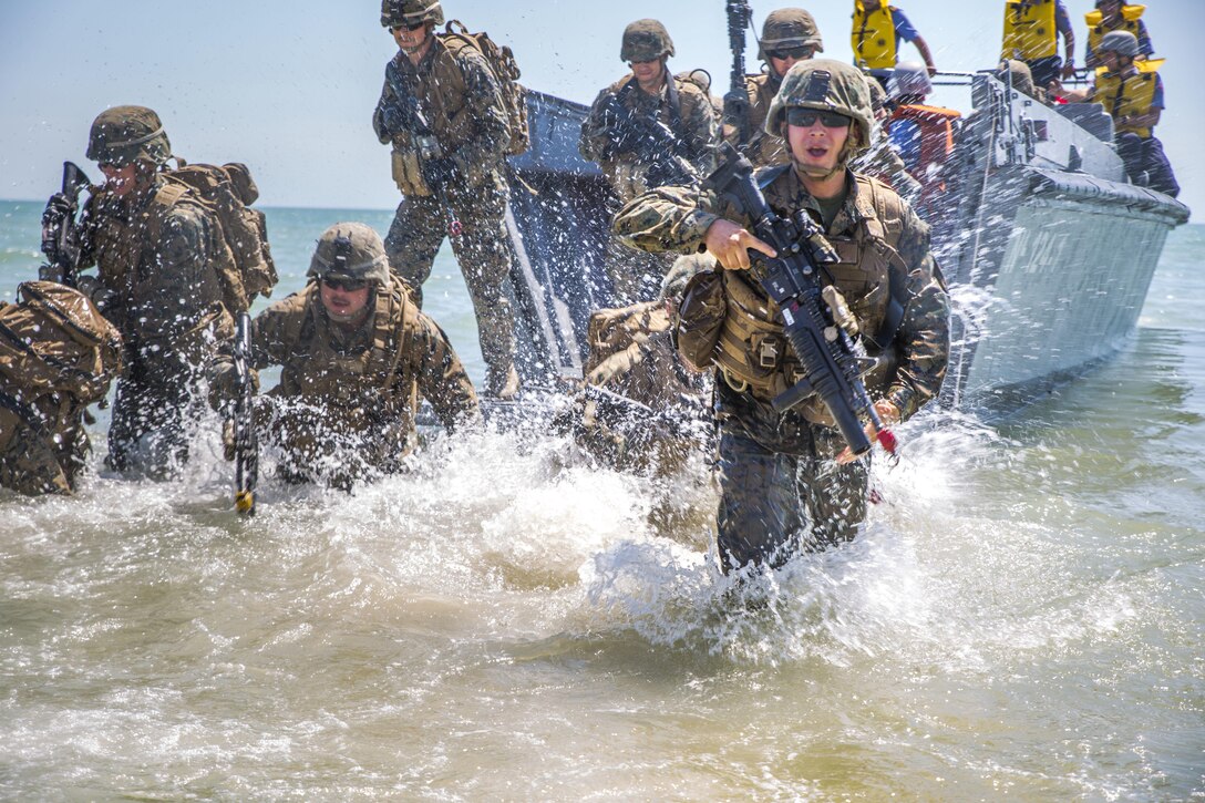 Marines assigned to the 3rd Battalion, 23rd Marine Regiment, assault a beach using a Turkish Higgins landing boat from the Turkish ship TCG Karamurselbey during exercise Sea Breeze 2017 in Mykolayivka, Ukraine, July 19, 2017. Sea Breeze is a U.S. and Ukraine co-hosted multinational maritime exercise held in the Black Sea and is designed to enhance interoperability of participating nations and strengthen maritime security within the region. Marine Corps photo by Staff Sgt. Marcin Platek
