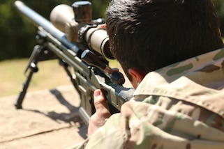 A U.S. Army Special Forces Soldier, who is part of a two-man sniper team, fires down range July 19, 2017 in Paraguari, Paraguay. The American sniper team is competing in Fuerzas Comando which is a multinational competition aiming to develop advanced tactical skills. (U.S. Army photo by Spc. Elizabeth Williams/Released)