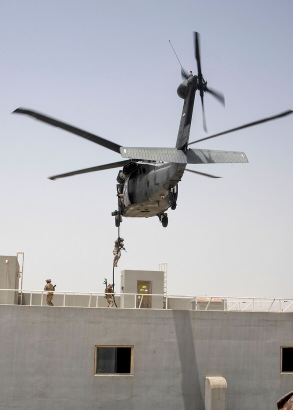 Abu Dhabi, UAE—Members of Special Operations Command Central (SOCCENT) jump out of a UH-60 helicopter during a training demonstration in support of the USCENTCOM component commanders conference July 21, 2017. The event was held to highlight the joint Special Operation Force specific training and the unique skills and capabilities that they bring to the USCENTCOM area of responsibility. (Department of Defense photo by U.S. Air Force Tech Sgt. Dana Flamer) 