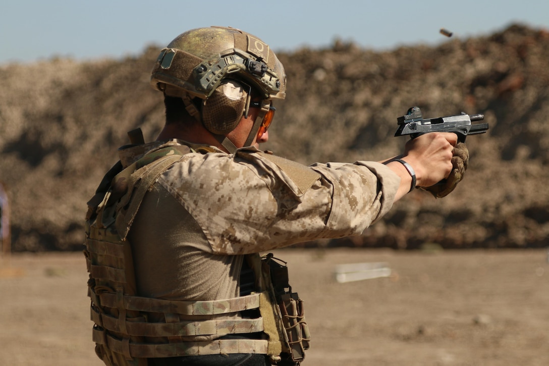 A Chilean competitor fires his pistol in the stress shoot event July 21, 2017 during Fuerzas Comando in Vista Alegre, Paraguay. Chile and other competing nations share common security interests that the competition promotes. (U.S. Army photo by Spc. Elizabeth Williams/Released)
