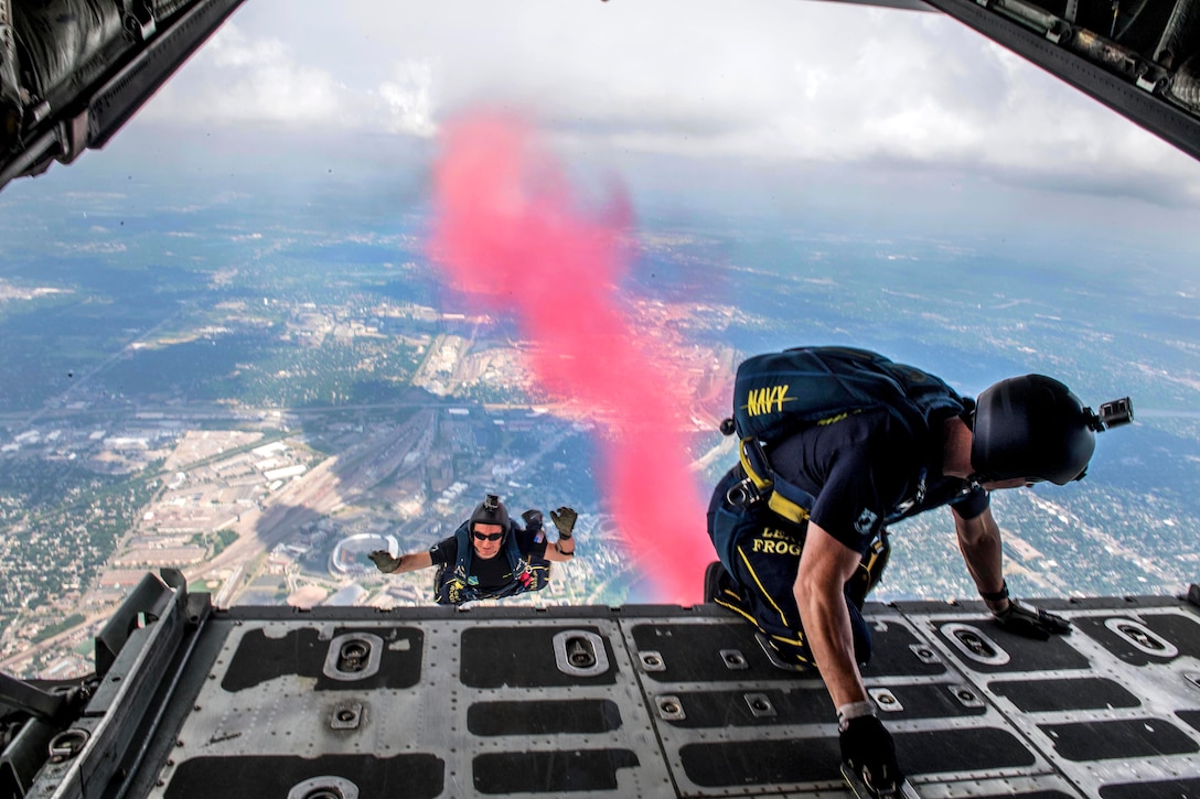 Members of U.S. Navy Parachute Team “The Leap Frogs,” jump from a C-130 Hercules aircraft during a skydiving demonstration at the Summer X Games in Minneapolis, July 15, 2017. Peterson is a Special Warfare operator. Navy photo by Petty Officer 3rd Class Kelsey L. Adams