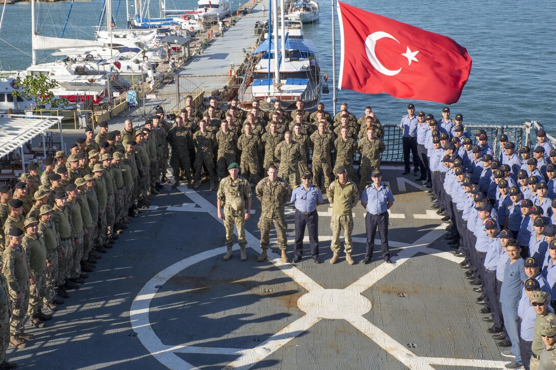 U.S. Marines with 3rd Battalion, 23rd Marine Regiment, stand in formation along with Ukrainian marines and Turkish sailors and marines aboard the Turkish ship TCG Karamurselbey (NL-124), July 14, in the Black Sea, during exercise Sea Breeze 2017.  Sea Breeze is a U.S. and Ukraine co-hosted multinational maritime exercise held in the Black Sea and is designed to enhance interoperability of participating nations and strengthen maritime security within the region.(U.S. Marine Corps photo by Staff Sgt. Marcin Platek/Released)