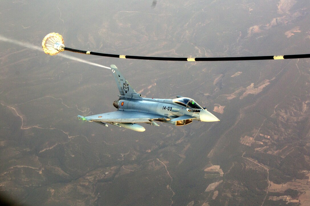A Spanish Air Force Eurofighter Typhoon trails a U.S Marine KC-130J assigned to Special Purpose Marine Air-Ground Task Force-Crisis Response-Africa as it prepares to receive fuel as part of a bilateral fixed-wing air-to-air refueling training near Morón Air Base, Spain, July 13, 2017. SPMAGTF-CR-AF deployed to conduct limited crisis response and theater security operations in Europe and North Africa. (U.S. Marine Corps Photo by SSgt. Kenneth K. Trotter Jr.)