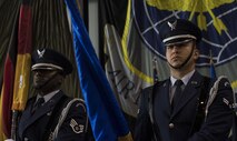 U.S. Air Force Staff Sgt. Terry Cooper, Noncommissioned Officer in Charge of Base Honor Guard (left), and U.S. Air Force Airman 1st Class Don Royal Two Elk, Ramstein Base Honor Guardsman and 86th Aerospace Medicine Squadron bioenvironmental engineering technician, post the colors during the singing of the U.S. and German national anthems at a change of command ceremony on Ramstein Air Base, Germany, July 20, 2017. The Ramstein Base Honor Guard is open to Airmen of all ranks and is comprised entirely of volunteers. (U.S. Air Force photo by Senior Airman Tryphena Mayhugh)