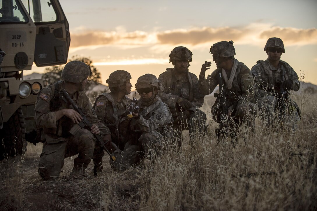 U.S. Army Reserve military police Soldiers from the 56th Military Police Company, the 382nd Military Police Battalion and the 344th Military Police Company, conduct a leader reconnaissance the night before a morning mission during a Combat Support Training Exercise (CSTX) at Fort Hunter Liggett, California, July 22, 2017. (U.S. Army Reserve photo by Master Sgt. Michel Sauret)