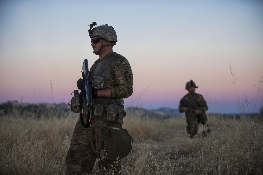 U.S. Army Reserve military police Soldiers from the 56th Military Police Company, the 382nd Military Police Battalion and the 344th Military Police Company, conduct a reconnaissance patrol the night before a morning mission during a Combat Support Training Exercise (CSTX) at Fort Hunter Liggett, California, July 22, 2017. (U.S. Army Reserve photo by Master Sgt. Michel Sauret)